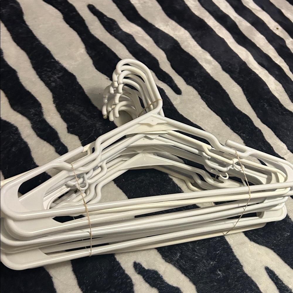 25 white plastic hangers bundle